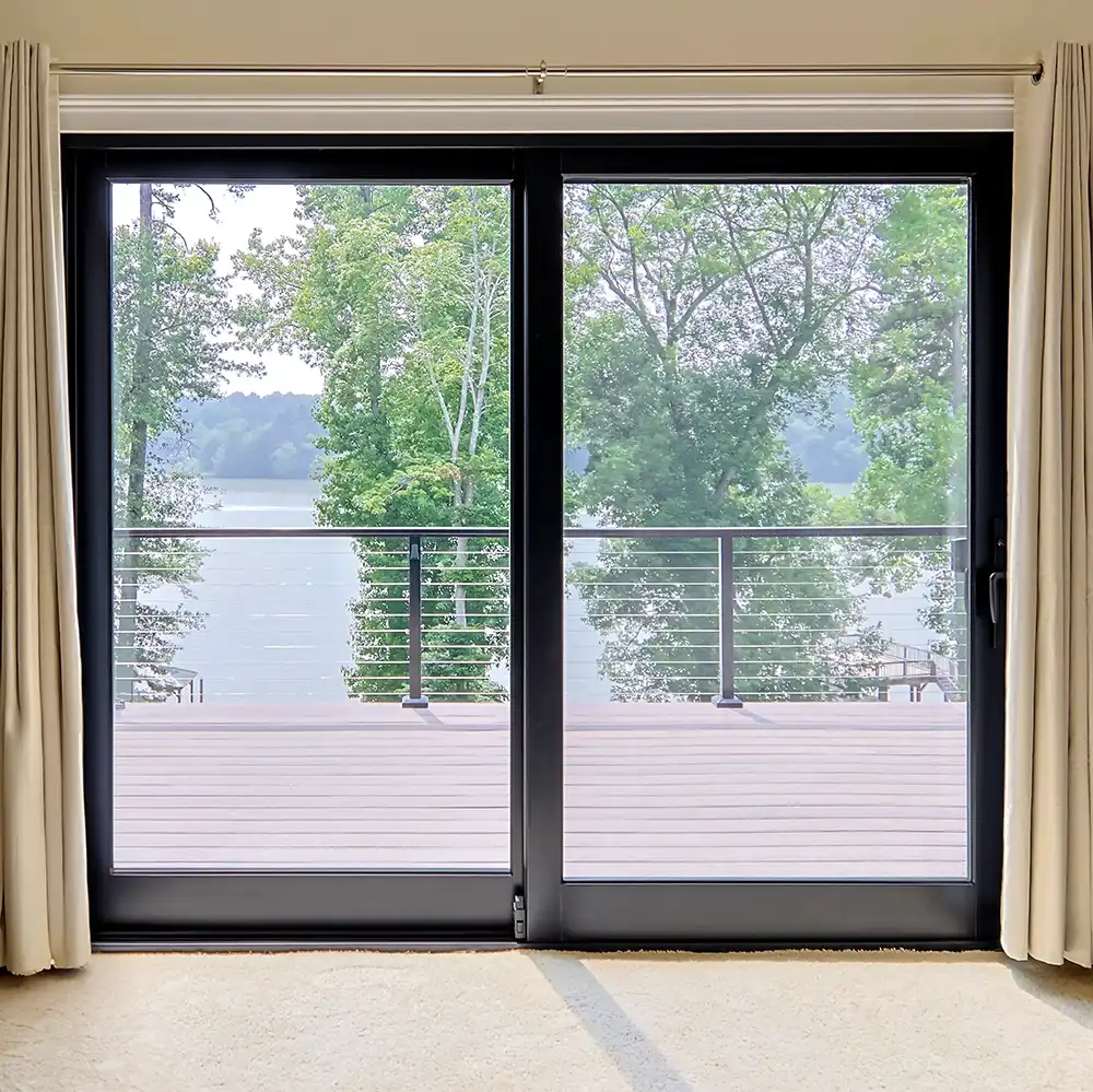 Interior view of a two-panel black Marvin Replacement sliding French door.
