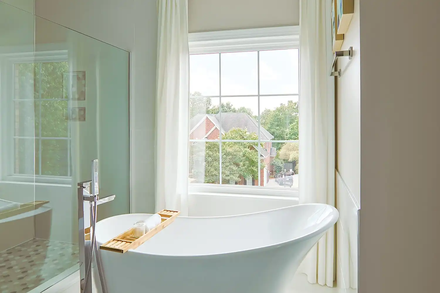 Interior view of a white bathroom window with grilles.